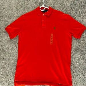 Men’s new orange with tags golf shirt size smalll